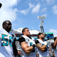 Telvin Smith #50 of the Jacksonville Jaguars raises his arm in protest with teammates during the National Anthem prior to the game against the Baltimore Ravens at EverBank Field on September 25, 2016 in Jacksonville, Florida.